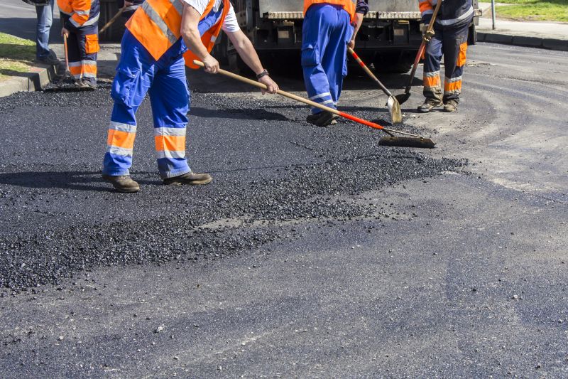 Local Asphalt Removal And Replacement pros at work